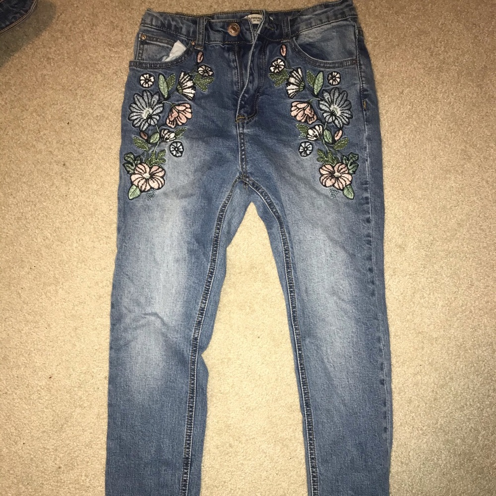 Pink flower embroidered denim jeans